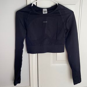 Gymshark- black, cropped, long sleeve shirt with cut out back.